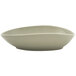 A close-up of a Front of the House Tides Pumice oval bowl with a curved edge.
