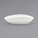 A Front of the House Tides oval porcelain bowl in white on a gray background.