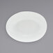 A Front of the House Tides white oval porcelain bowl on a gray surface.
