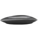 A black oval porcelain platter with a curved edge.