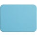 A blue rectangular Tomlinson Chef's Edge cutting board with a white border.