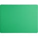 A green rectangular cutting board on a white surface.