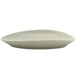 A white Front of the House Tides oval porcelain plate with a curved edge.