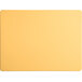 A yellow rectangular Tomlinson Chef's Edge cutting board with a white border.