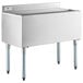 A Regency stainless steel underbar ice bin with sliding lid and bottle holders on a counter.