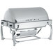 A Vollrath stainless steel rectangular chafer with a fully retractable roll top lid on a counter.
