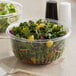 Dart PET plastic deli containers filled with salad.