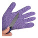 A person holding a knife over a small purple San Jamar cut resistant glove.