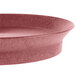 A close-up of a red oval deli server with a raspberry rim.