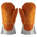 A pair of orange leather oven mitts with white stitching.
