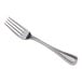 An Acopa Lydia silver fork on a white background.