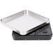 A close-up of the Edlund ERS-60 RB square metal tray with a black surface.