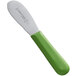 A Dexter-Russell green scalloped sandwich spreader with a green handle and green blade.