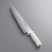 A Dexter-Russell Sani-Safe Scalloped Chef Knife with a white handle.