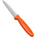 A Dexter-Russell paring knife with an orange handle.
