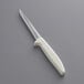 A Dexter-Russell Sani-Safe boning knife with a white handle.
