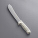 A Dexter-Russell butcher knife with a white handle.