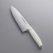 A Dexter-Russell chef knife with a white handle.