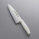 A Dexter-Russell scalloped chef knife with a white handle.