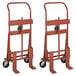 Two red Wesco Industrial Products machinery movers with black wheels.
