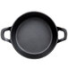A black round cast iron pan with two handles.