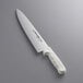 A Dexter-Russell Sani-Safe chef knife with a white handle.