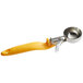 A yellow and silver Thunder Group #20 ice cream scoop with an ergonomic handle.