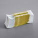 A stack of gold and white paper money straps.