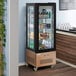 An Avantco copper glass door refrigerated display case with drinks and beverages inside.
