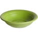 An Acopa Capri green stoneware fruit bowl with a rim.