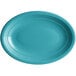 A Caribbean turquoise oval stoneware platter with a white border.