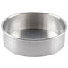 A close-up of a round silver Baker's Mark aluminum cake pan with a removable bottom.