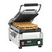 A sandwich on a Waring Compresso Slimline Panini Grill with grooved plates.