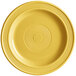 A yellow Acopa Capri stoneware plate with a circular design in the middle.