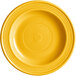 A mango orange Acopa Capri stoneware plate with a circular design.