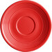 A red Acopa Capri stoneware saucer with a rim and circular object.