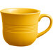 An Acopa Capri mango orange stoneware cup with a handle on a white background.