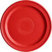 A close-up of an Acopa Capri passion fruit red stoneware plate with a circular pattern.