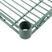 A close-up of a Hunter Green Metro Super Erecta wire shelf with a metal grid.
