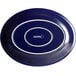 An Acopa Capri deep sea cobalt blue oval stoneware platter with white text on it.