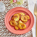 A close up of fried plantains on an Acopa Capri coral reef stoneware plate.