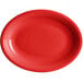 An oval red Acopa Capri stoneware platter with a rim.