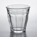 A Duralex Picardie clear glass tumbler on a white surface.
