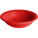 A red Acopa Capri stoneware bowl with ripples in the surface.