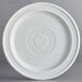 An Acopa Capri coconut white stoneware plate with a circular pattern on it.