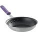 A Vollrath stainless steel frying pan with a purple Allergen-Free sleeve handle.
