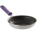 A Vollrath Wear-Ever non-stick aluminum frying pan with a purple handle.