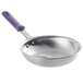 A Vollrath Wear-Ever aluminum frying pan with a purple allergen-free sleeve handle.