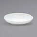 A Front of the House white porcelain oval bowl on a gray background.