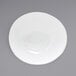 A white Front of the House Ellipse porcelain bowl on a gray surface.